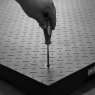 Top plate access to foot adjustment